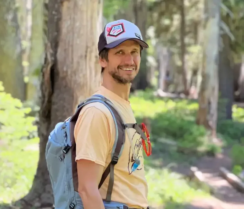 Dmitriy, founder of Neat Hive Cleaning, outdoors in Oregon